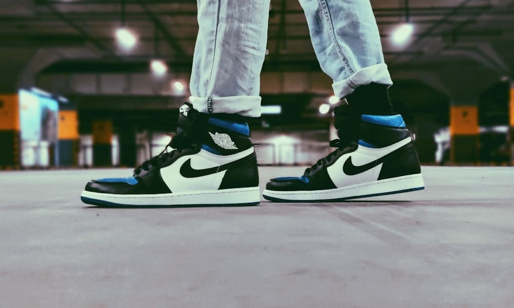 Royal Toe Jordan 1s on feet in a parking garage