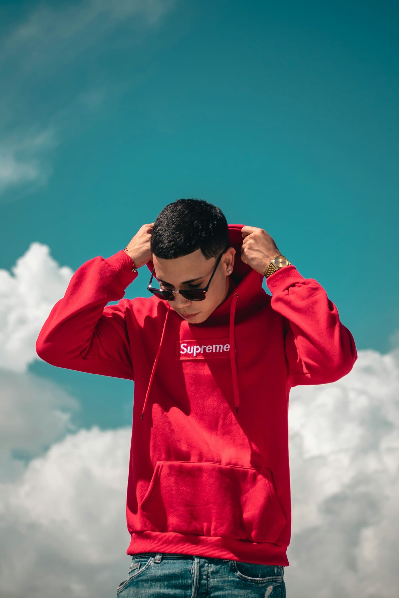 Red streetwear hoodie worn on the street