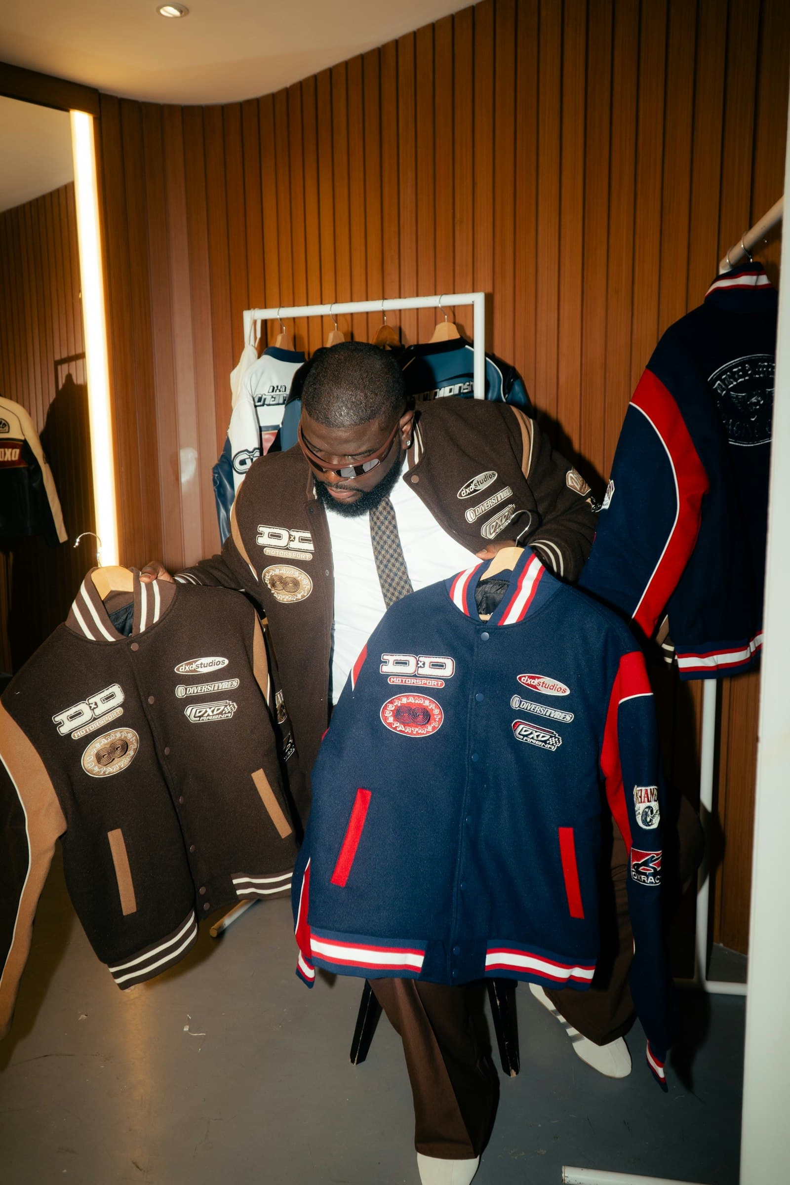 Varsity jackets held up inside a store